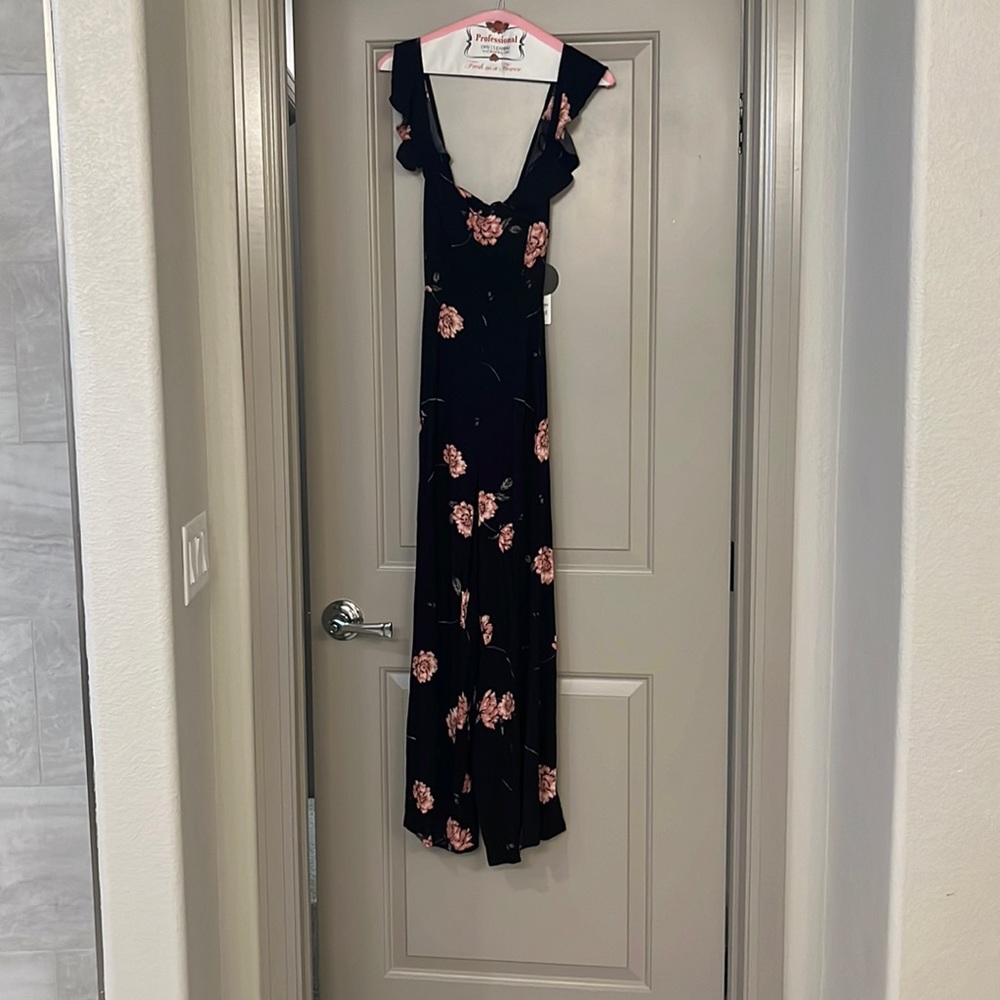 New with tag black floral jumpsuit with tie back